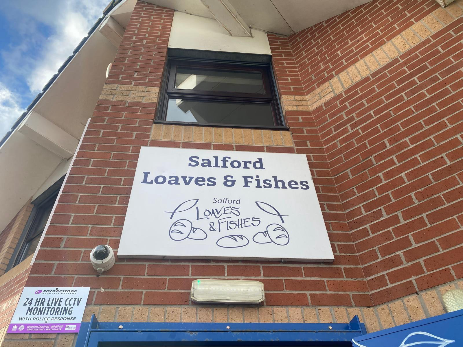 The Salford Loaves and Fishes building sign