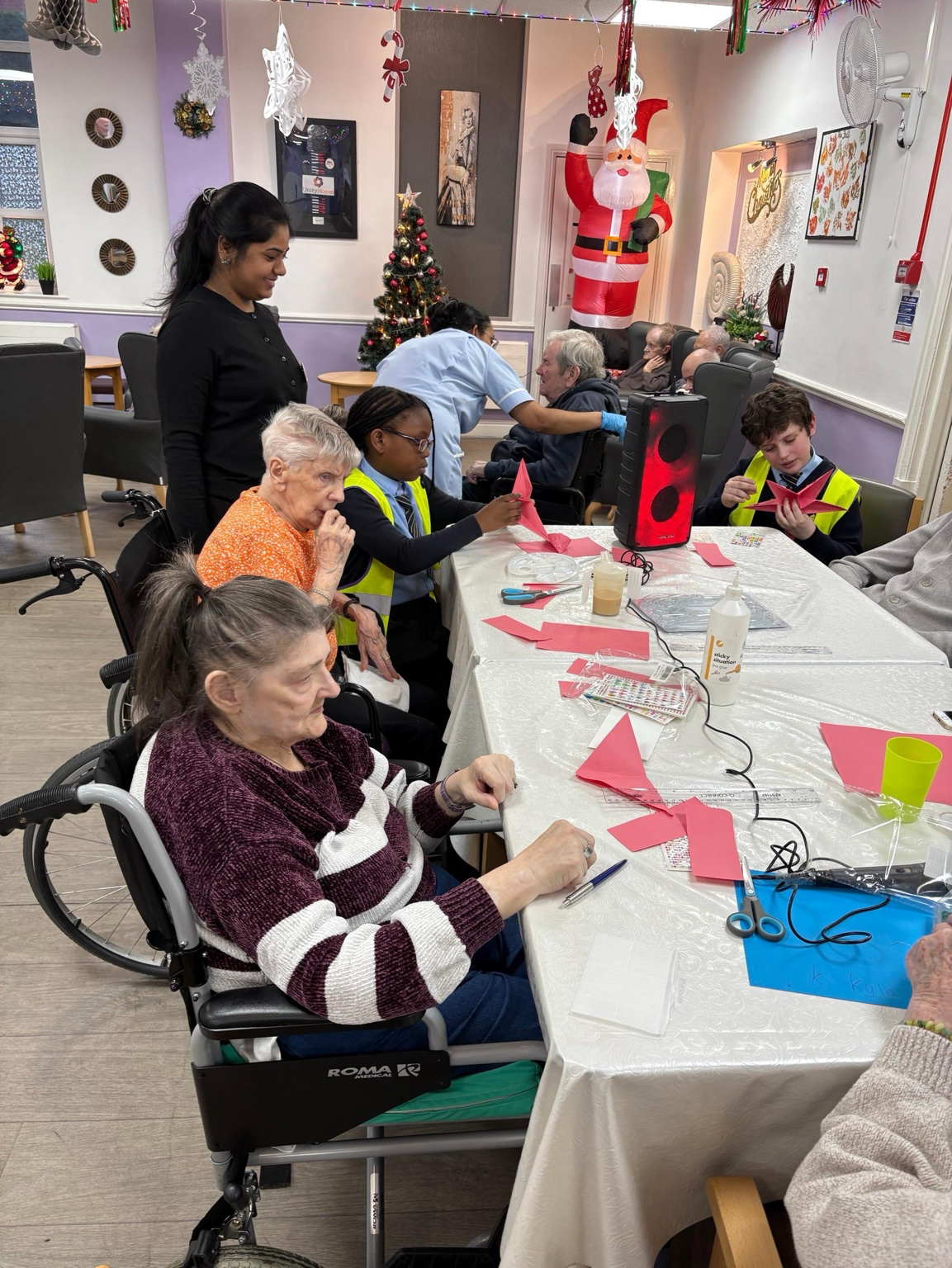 St Boniface pupils making Christmas crafts with care-home residents